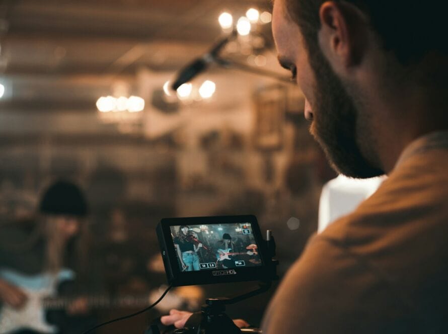 man holding black video camera